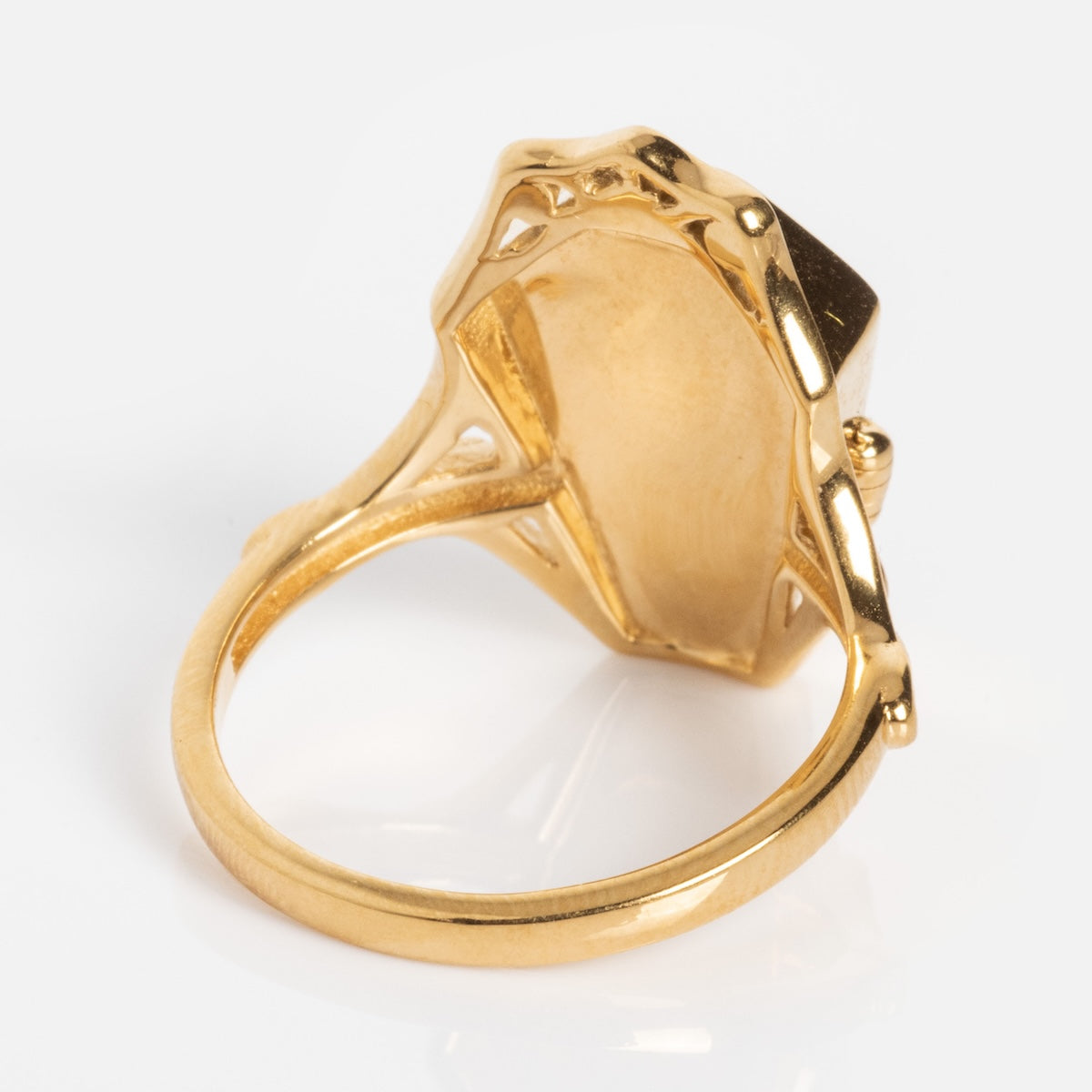 The Limited Edition Til Death Do Us Part Poison Ring features an ornate, geometric setting with detailed metalwork and a smooth band, showcased from the underside against a white background.
