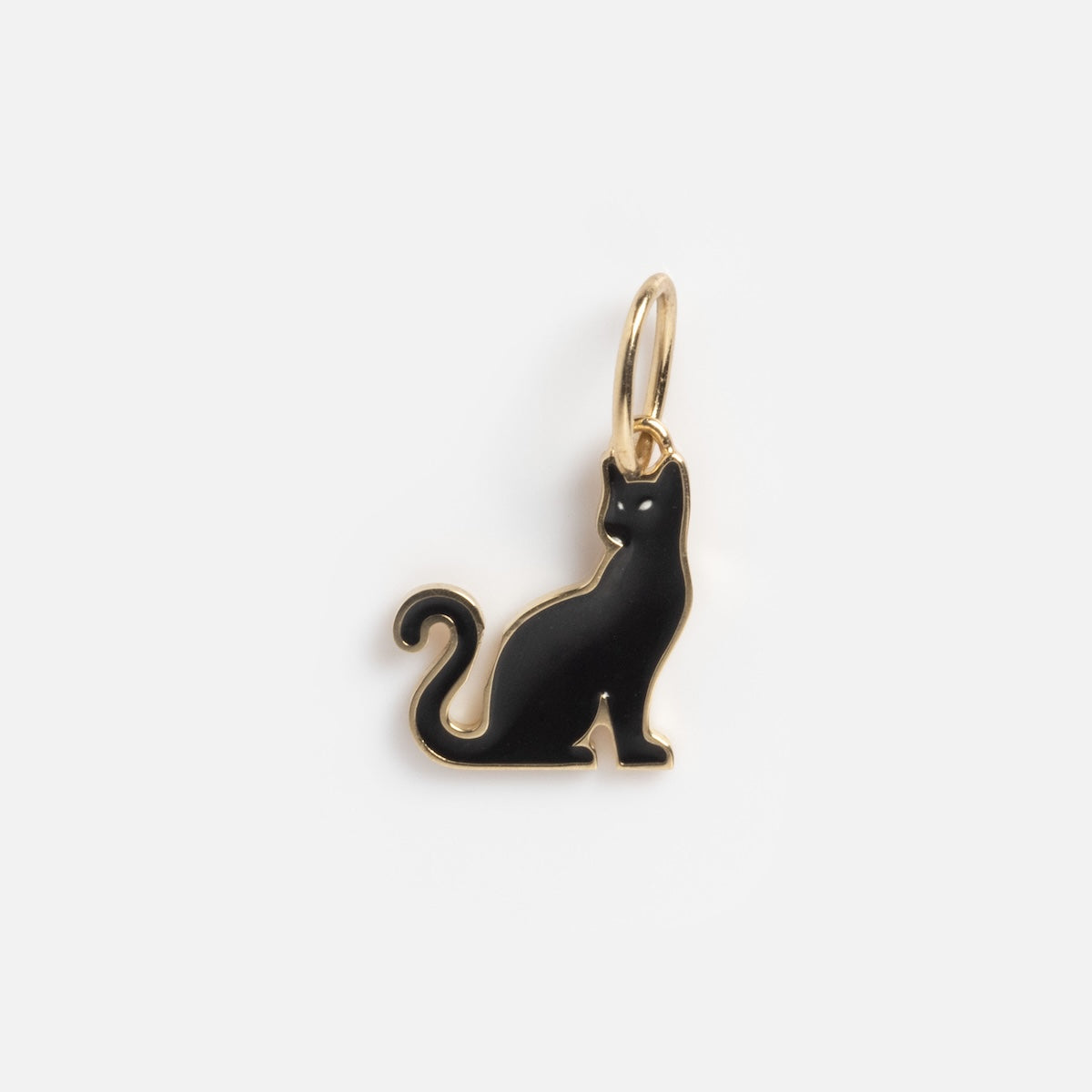 The Limited Edition Solid Gold Halloween Superstitions Charm features a black cat shape with gold trim, a curled tail, and a gold loop for attaching, shown on a white background.