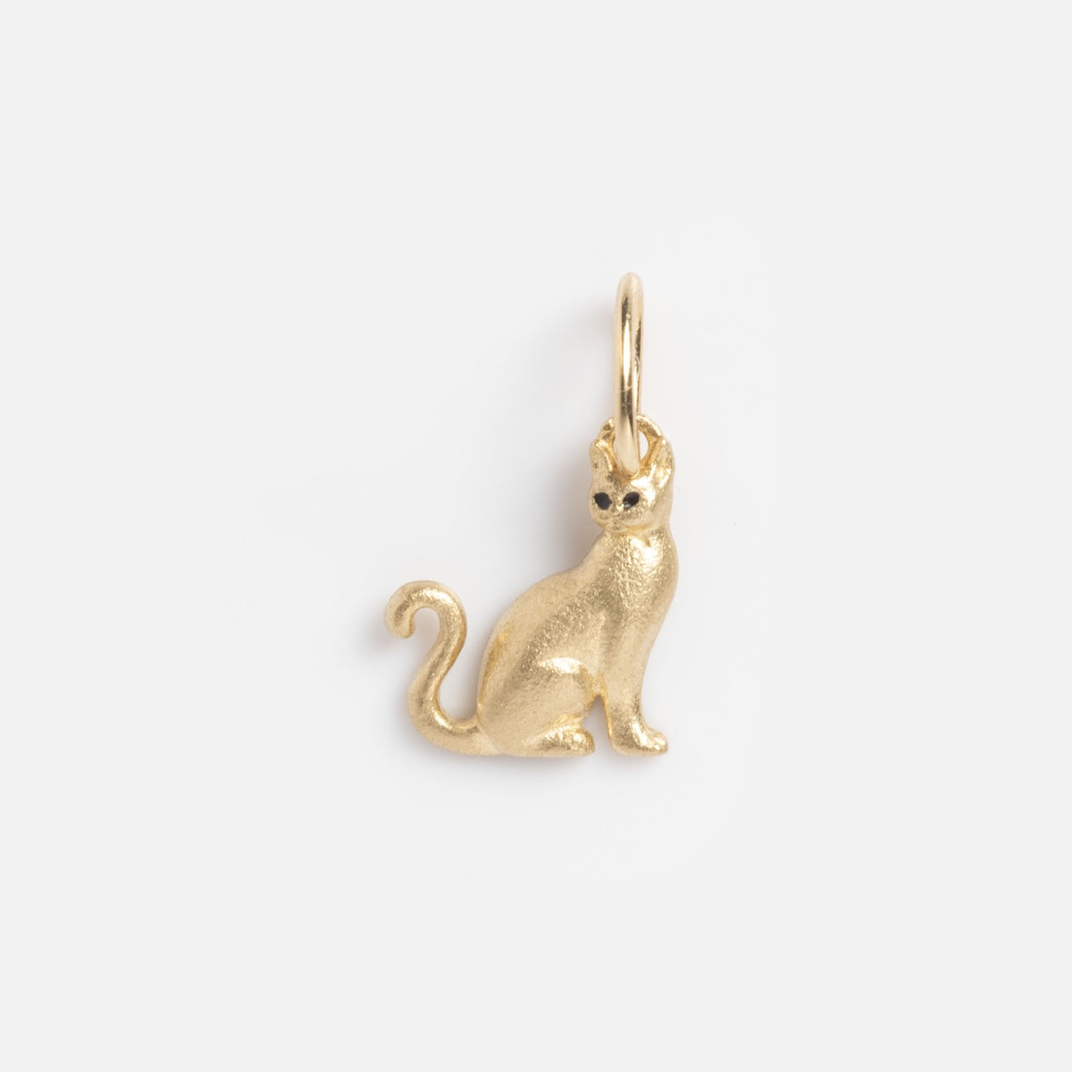 Limited Edition Solid Gold Halloween Superstitions Charm: a cat-shaped charm with a smooth, shiny finish, featuring a sitting cat with upright ears and curled tail, attached to a small loop. Displayed on a plain white background.