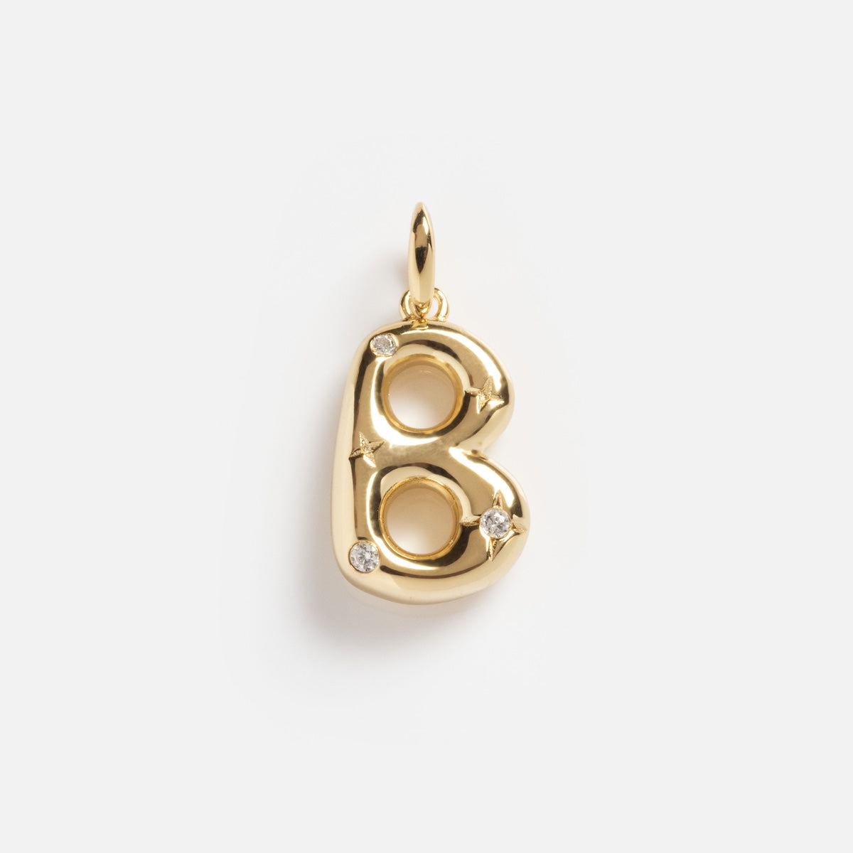 The Star Crossed Celestial Bubble Letter Charm is a gold B-shaped pendant featuring three small diamonds, photographed on a plain white background.
