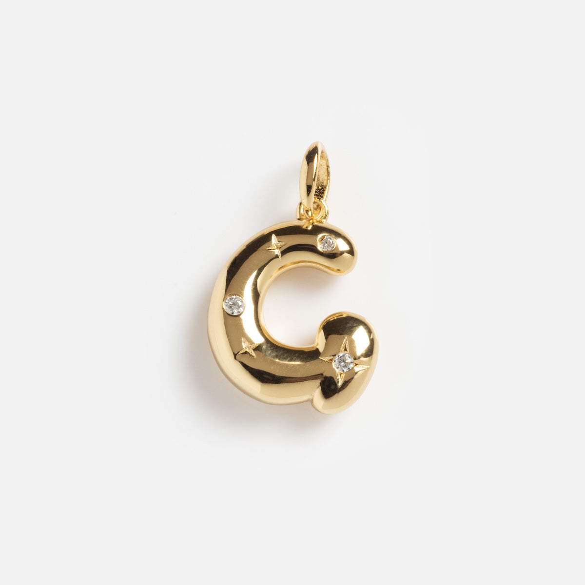 The Star Crossed Celestial Bubble Letter Charm is a shiny gold pendant shaped like the letter C, featuring three round diamonds and two star-shaped accents, shown on a plain white background.