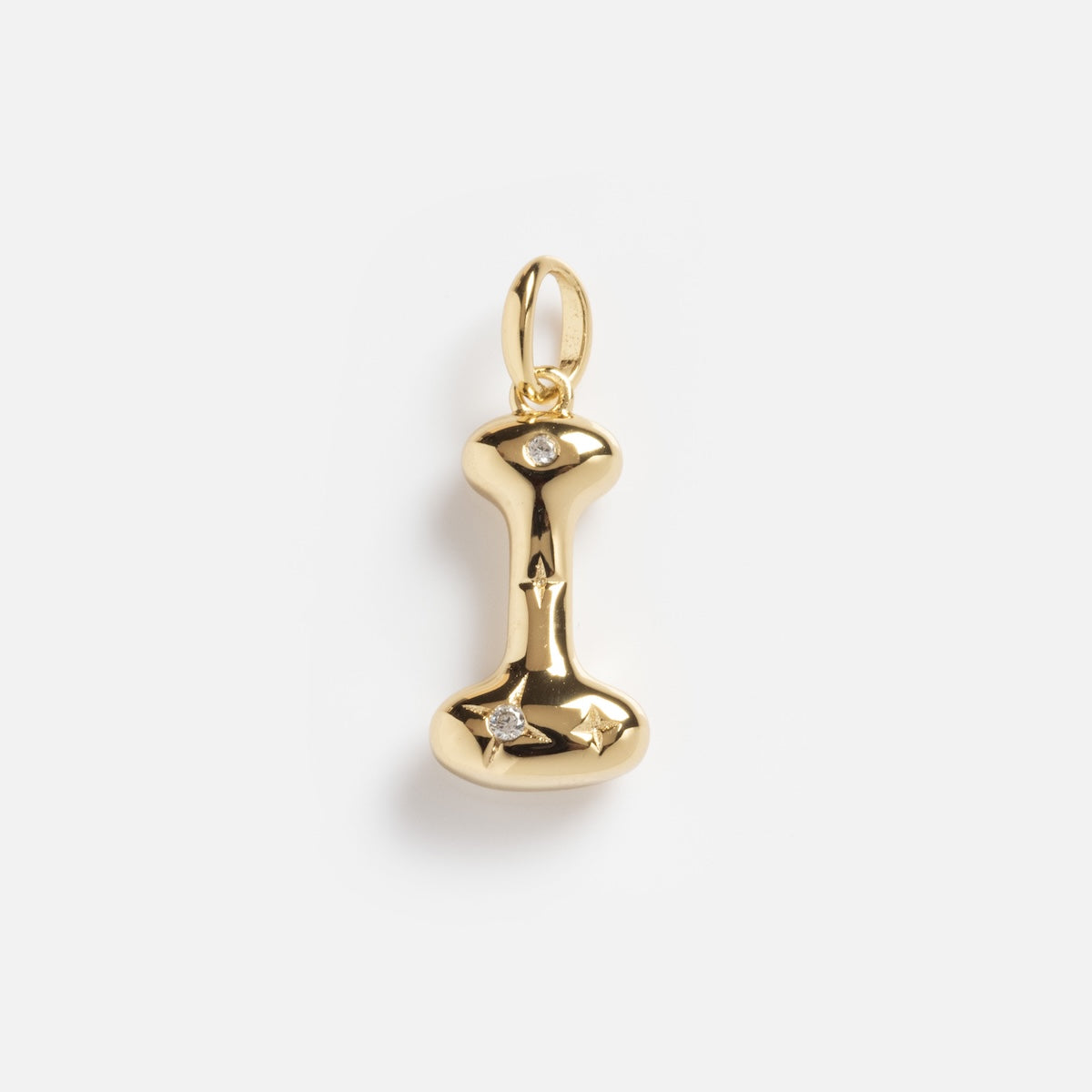 The Star Crossed Celestial Bubble Letter Charm is a gold pendant shaped like the letter I, featuring a smooth finish and two small diamonds, one at the top and one at the bottom, hanging from a gold loop against a white background.