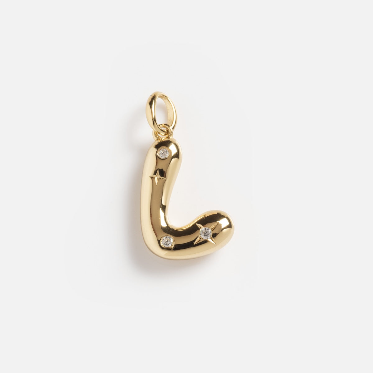 The Star Crossed Celestial Bubble Letter Charm is a gold pendant in the shape of the letter L, featuring small star engravings and three clear gemstones, displayed on a plain white background.