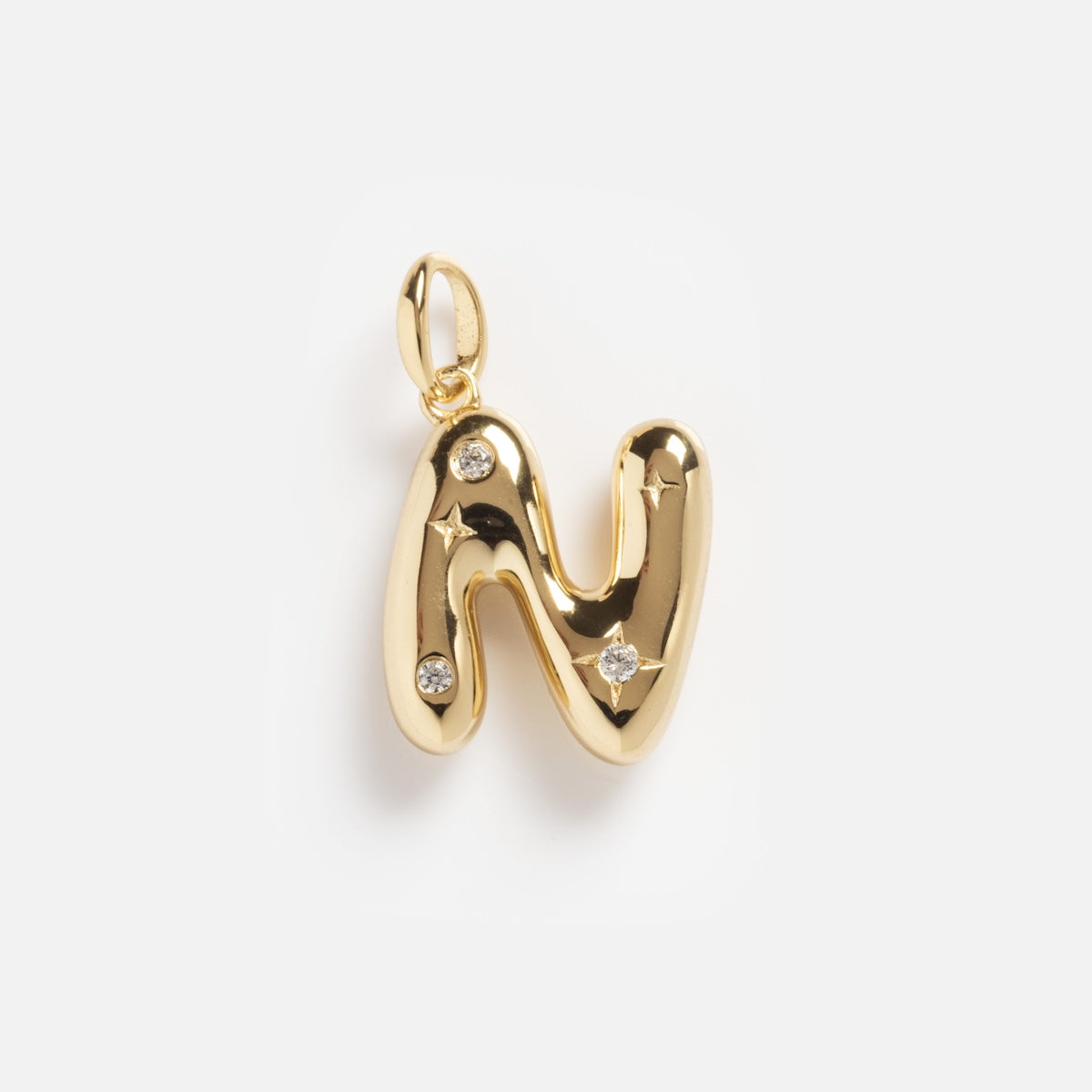 The Star Crossed Celestial Bubble Letter Charm is a gold pendant shaped like the letter N, featuring three small round gemstones, displayed on a plain white background.