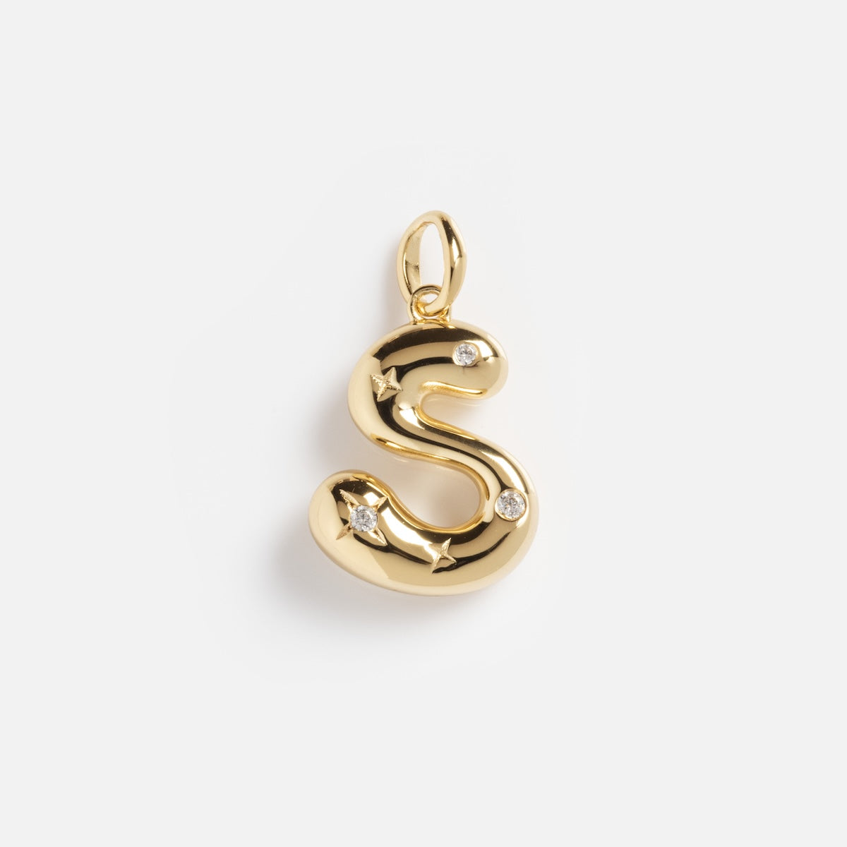 The Star Crossed Celestial Bubble Letter Charm is a gold pendant shaped like the letter S, featuring two small diamonds, shown against a white background.