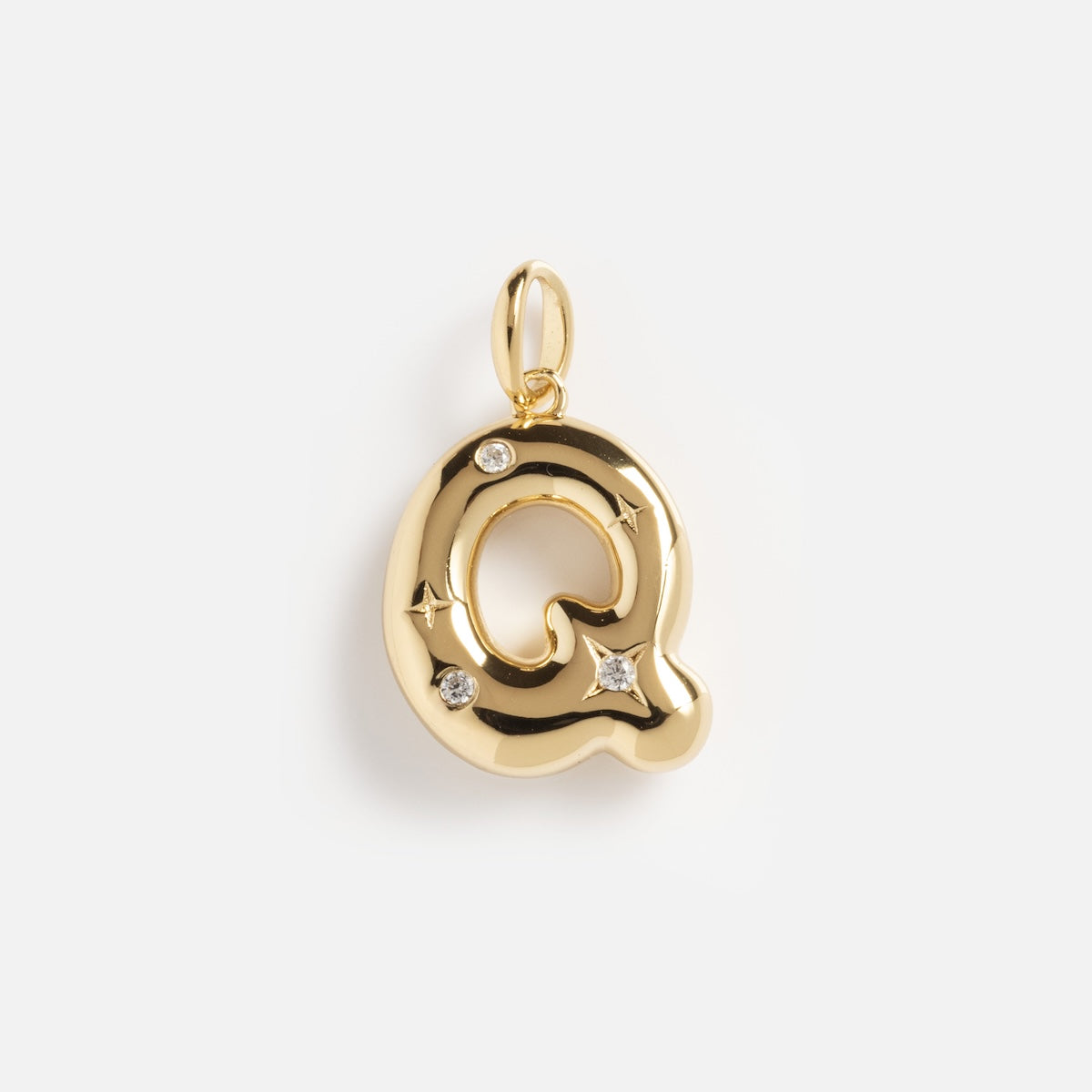 The Star Crossed Celestial Bubble Letter Charm is a gold Q-shaped pendant featuring three small diamonds and subtle star engravings, displayed on a plain white background.