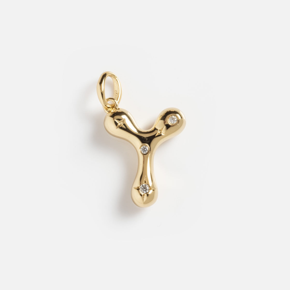 The Star Crossed Celestial Bubble Letter Charm is a gold pendant shaped like the letter Y, featuring three small embedded diamonds, shown against a plain white background.