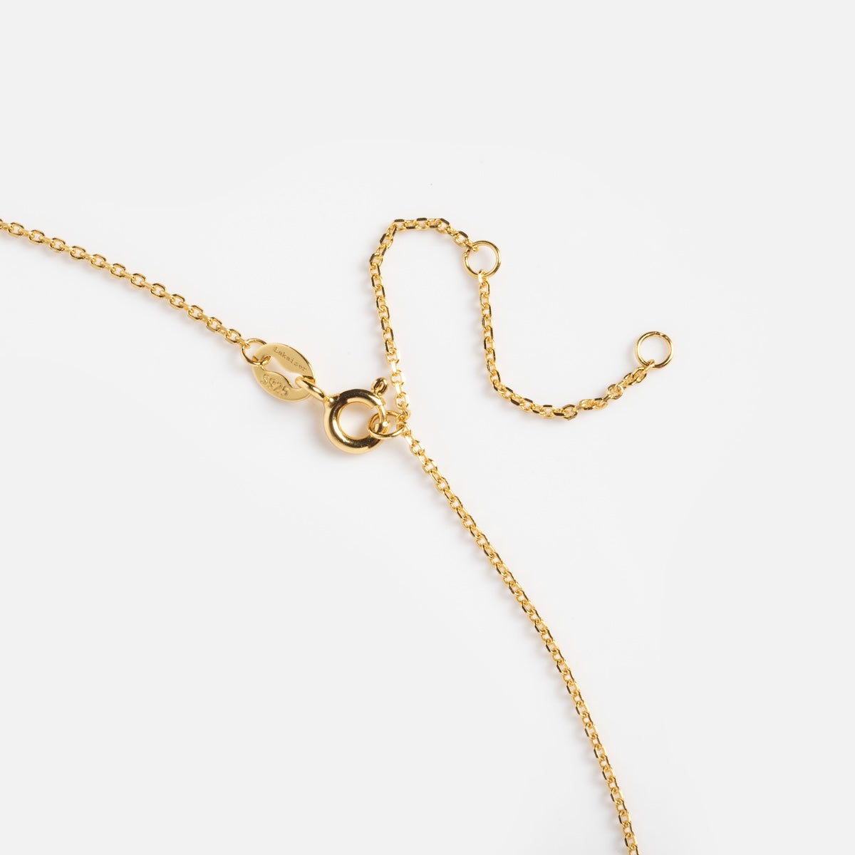 The Cotton Candy Opal Droplet Necklace features a delicate gold chain with a spring ring clasp and adjustable extension, showcased against a plain white background.