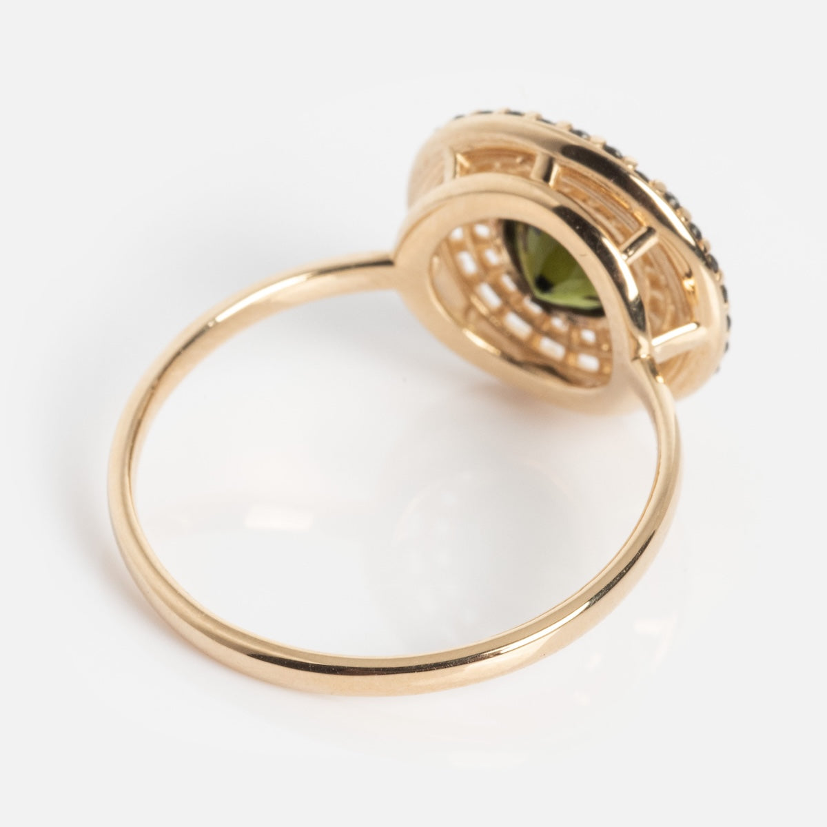 The Tantallon Black Diamond Ring, shown from an angled side and bottom view against a white background, features a gold lattice setting with a black diamond gemstone at its center.