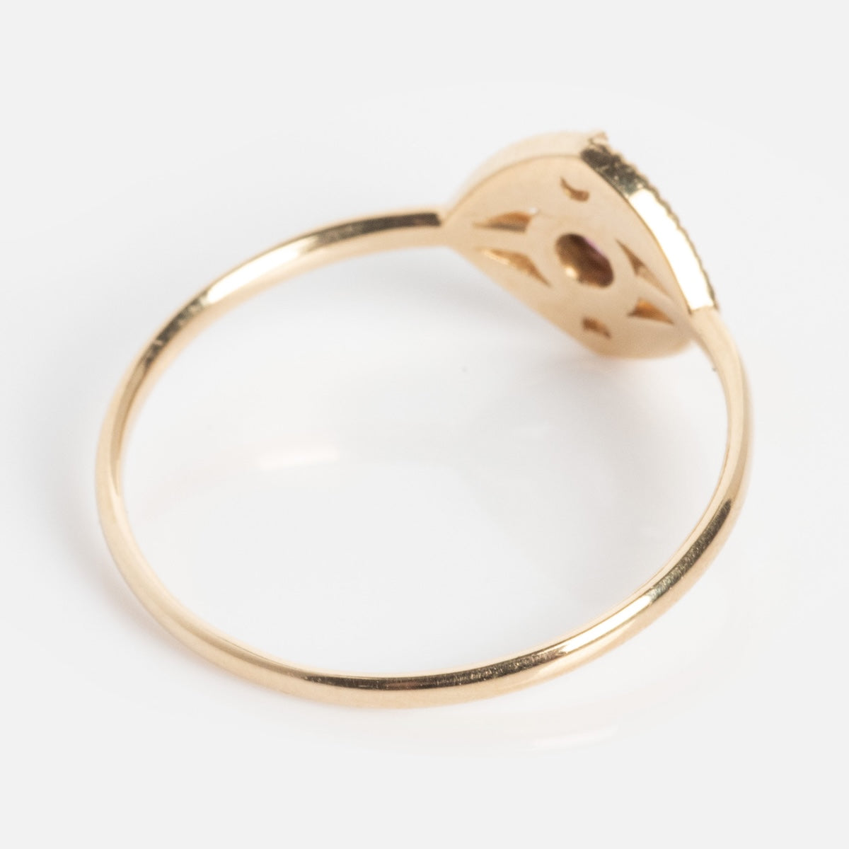 The Staffa White Diamond Ring features a thin gold band and a raised openwork setting, displayed from the side against a white background.