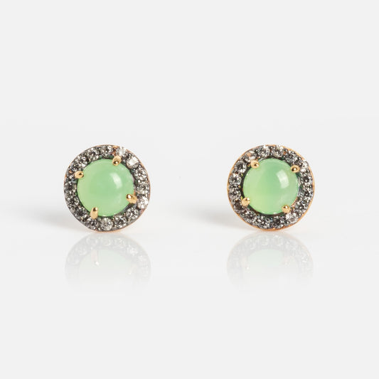 The Chrysoprase Pave Stud Earrings feature round green gemstones at the center, encircled by a border of sparkling pave stones set in gold-tone metal.
