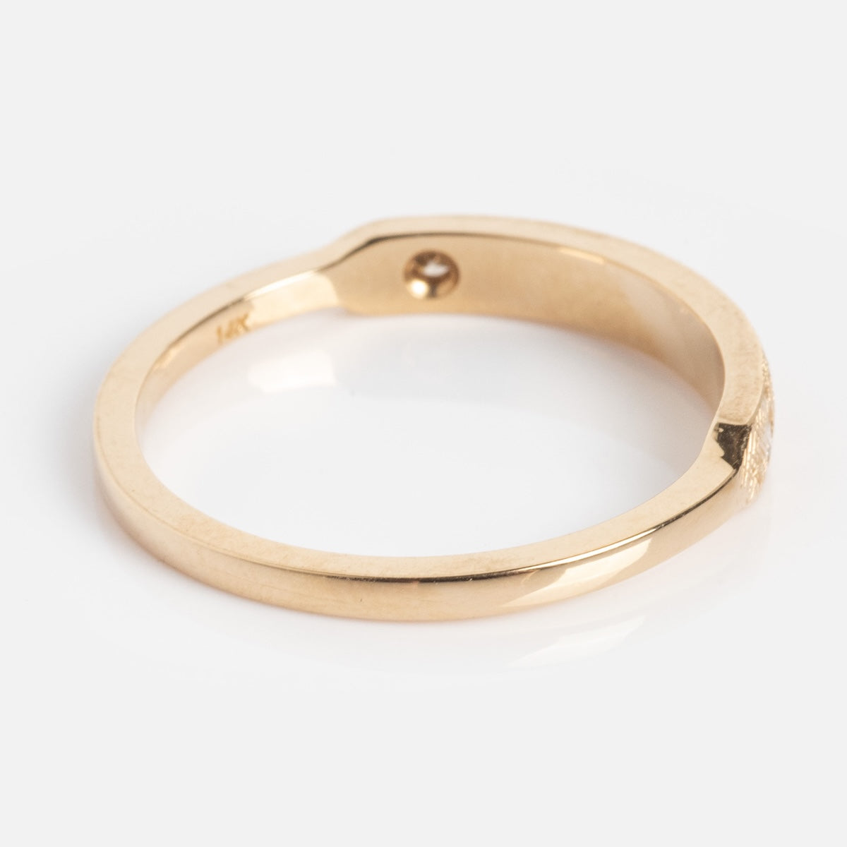 The Dukes Champagne Diamond Ring features a flat edge with a small round indentation, showcased against a white background.