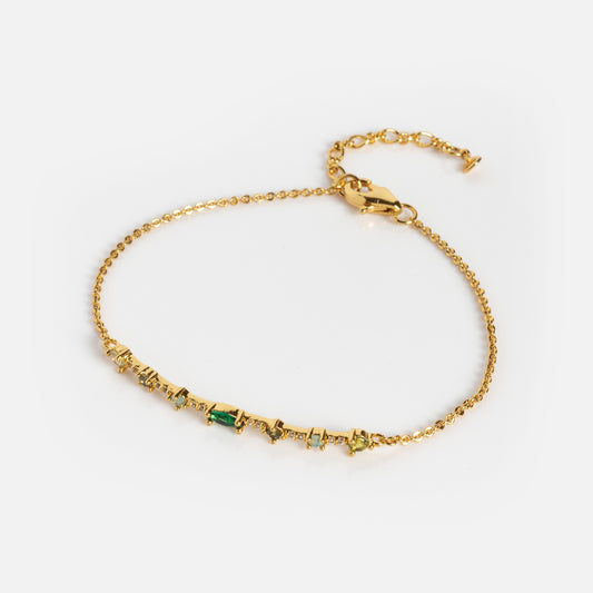 Colorful Bracelet Sample: A delicate gold chain bracelet with multi-shaped, multicolored gemstones set along the center and an adjustable clasp. Displayed on a plain white background.