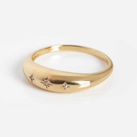 The Celestial Dome Ring Sample is a gold ring adorned with diamonds.