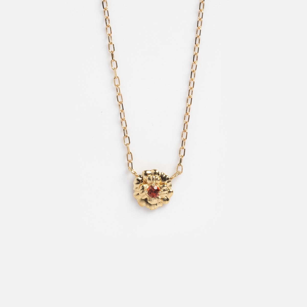Solid Gold Birth Flower Bloom Necklace featuring a delicate birth flower pendant with a subtle gemstone accent, displayed against a plain white background.