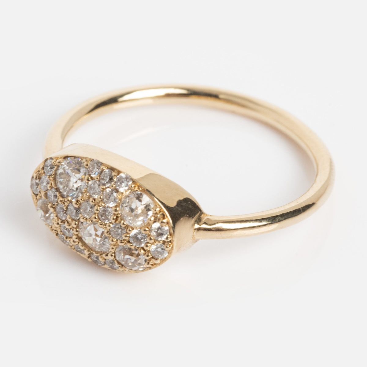 The "Eternal Flame" Soul Ring is a gold ring with an oval-shaped setting encrusted with multiple small, sparkling clear gemstones, shown against a plain white background.