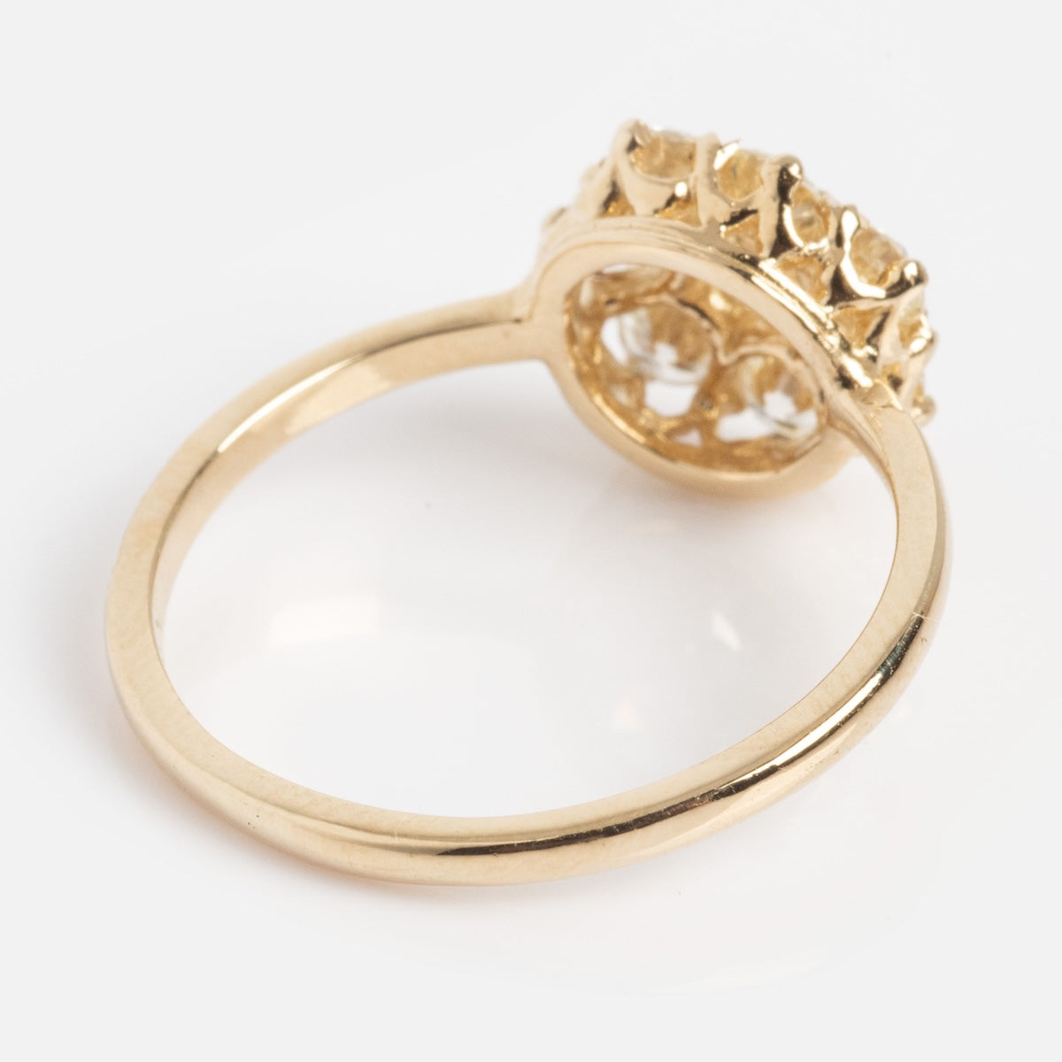 The Amas d'Etoiles Ring features a textured, raised cluster design on top and is shown against a white background.