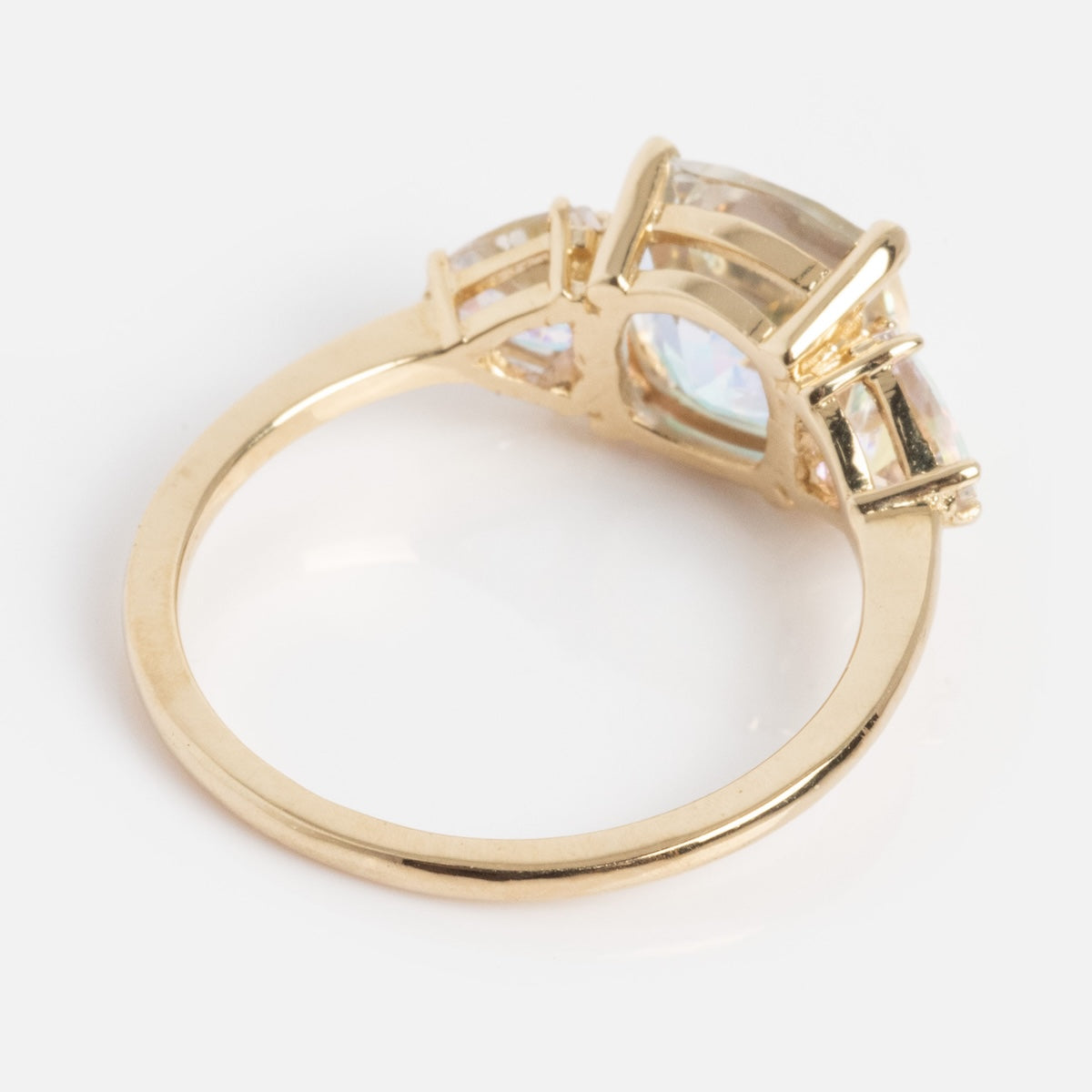 The Seraphina Ring features a large central clear gemstone with smaller clear stones along the band, displayed from a side angle on a white background.