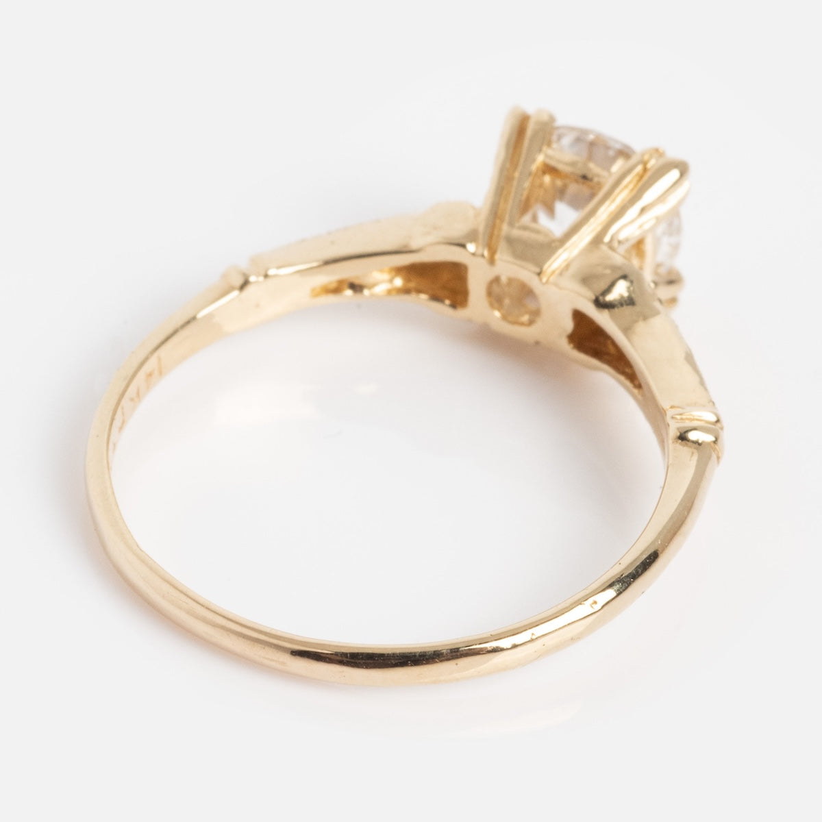 A close-up of the Elara Ring, featuring a large, clear gemstone in a raised prong setting, displayed against a plain white background.