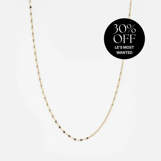 The Solid Gold Sparkle Link Chain, a delicate 14k gold necklace, is shown on a white background with a black label in the top right corner reading “30% OFF LE’S MOST WANTED.”.