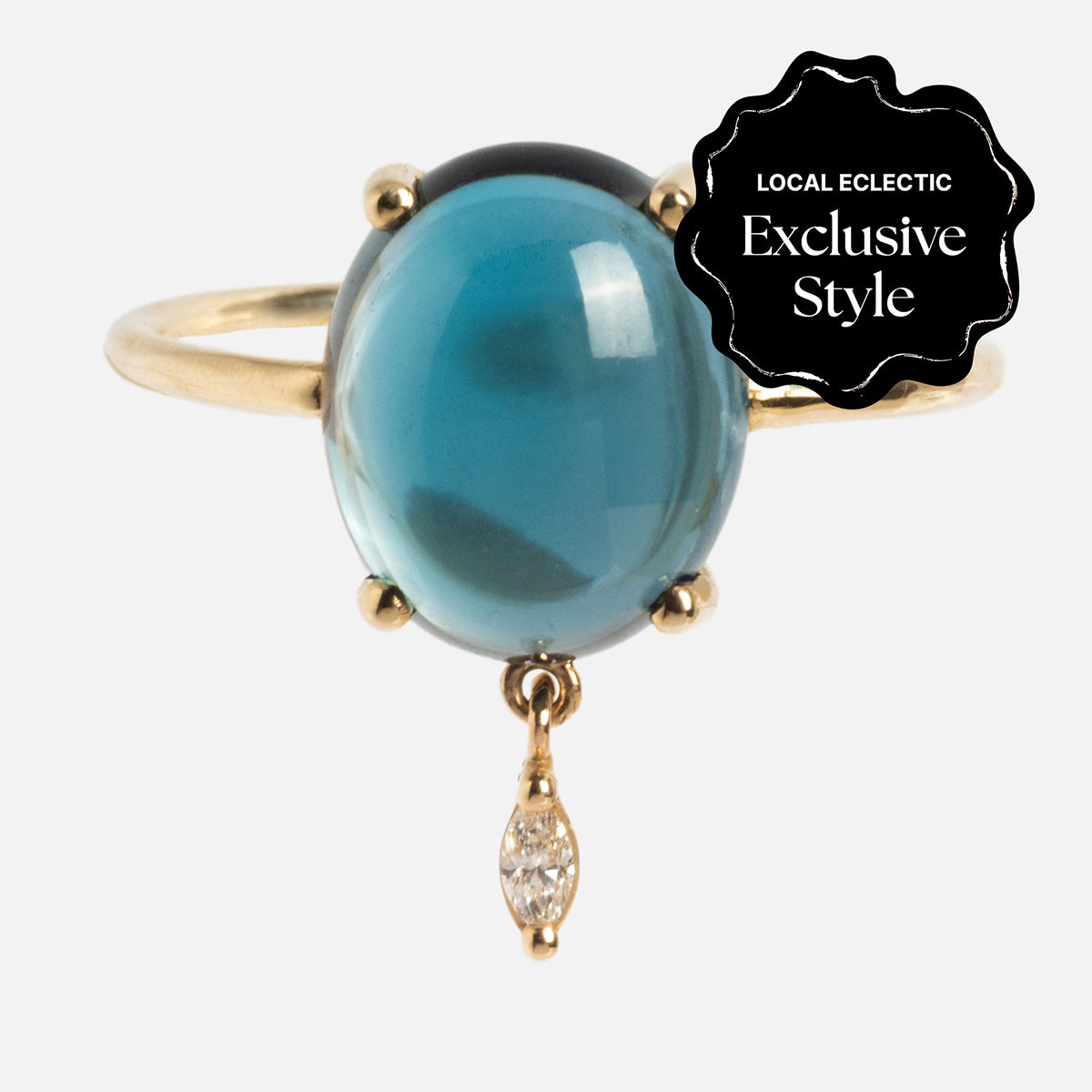 The One of a Kind 14k London Blue Topaz with Diamond Dangle Ring features a large oval blue gemstone set in gold and a small diamond accent that dangles below. A black label in the corner says Local Eclectic Exclusive Style.