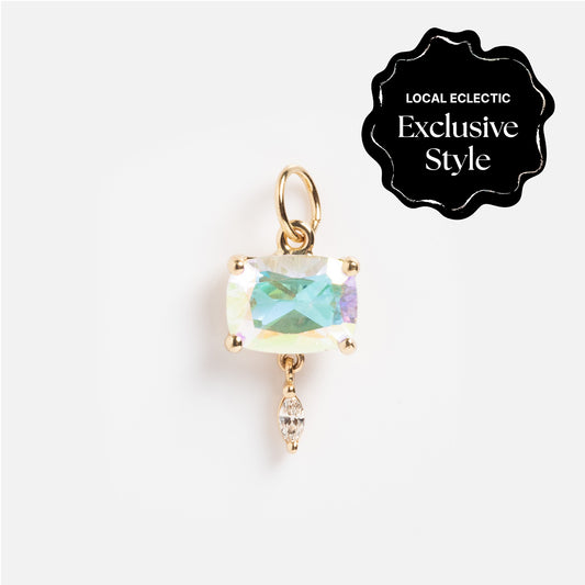 The One of a Kind 14k Pillow Cut Angel Aura with Diamond Dangle Charm features a rectangular iridescent gemstone and a teardrop-shaped diamond dangle, shown on white with a Local Eclectic Exclusive Style badge.