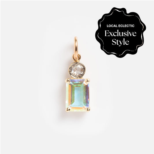The One of a Kind 14k Angel Aura and Diamond Charm features a gold pendant with a round clear diamond above a larger rectangular iridescent gem. A black "Local Eclectic Exclusive Style" label is in the corner, set against a white background.