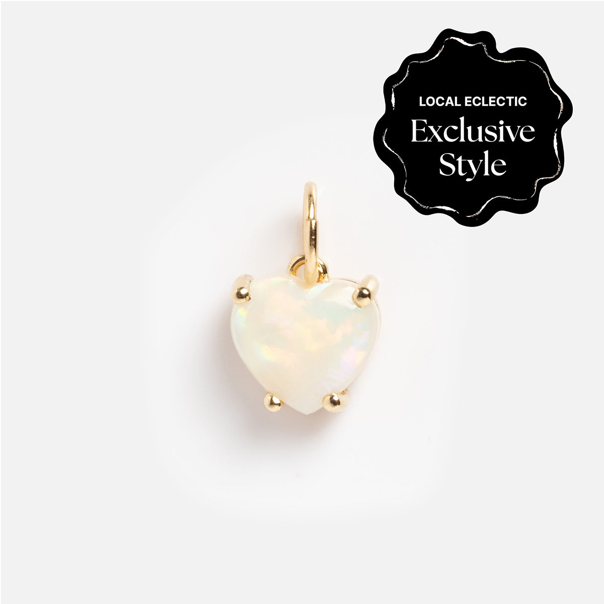 The One of a Kind 14k Opal Heart Charm features a heart-shaped opal set in gold prongs and bail, showcased on a white background with a black "LOCAL ECLECTIC Exclusive Style" label in the corner.