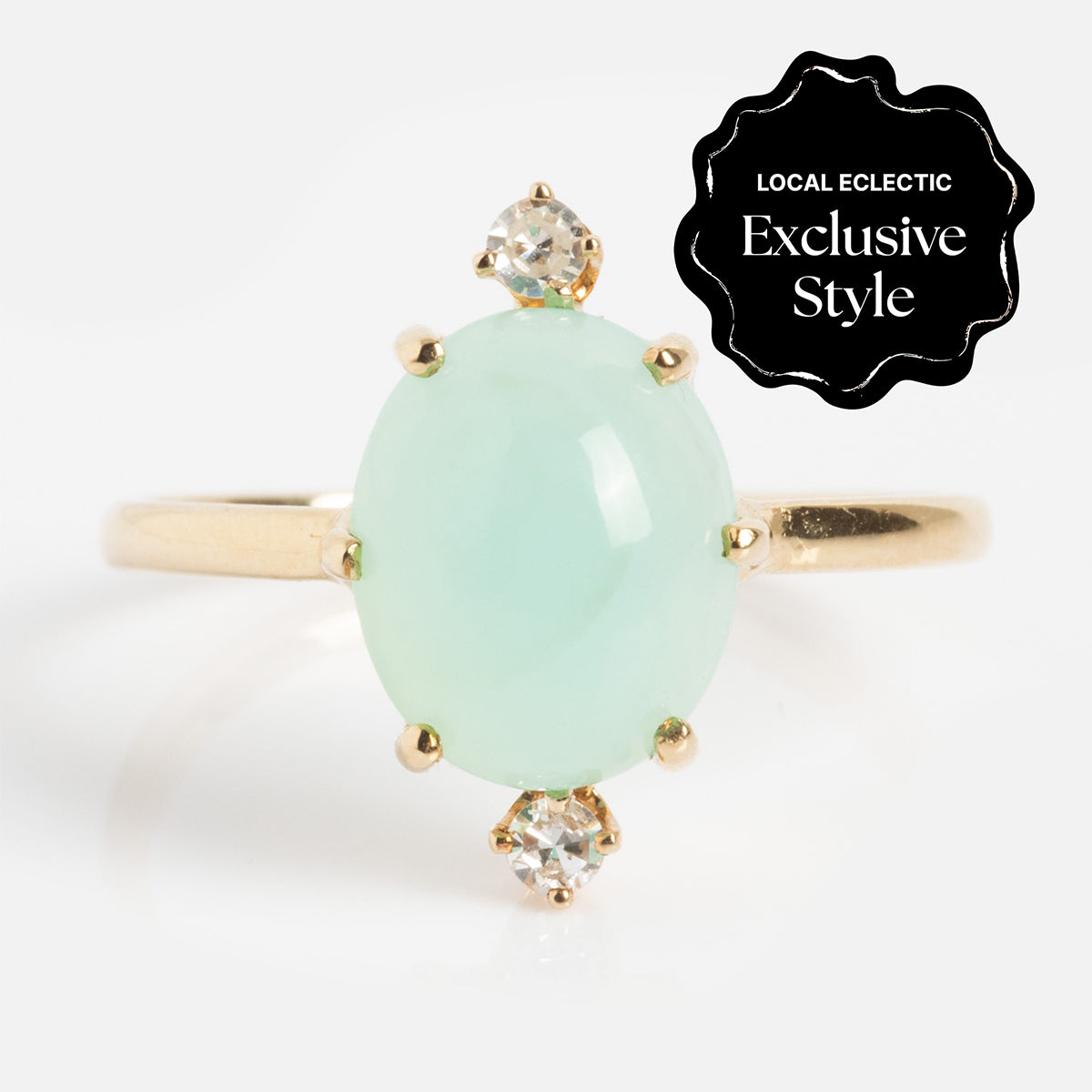 The One of a Kind 14k Peruvian Opal and Diamond Ring features an oval pale green opal centerpiece flanked by two small round diamonds. A black badge reads Local Eclectic Exclusive Style in white text.