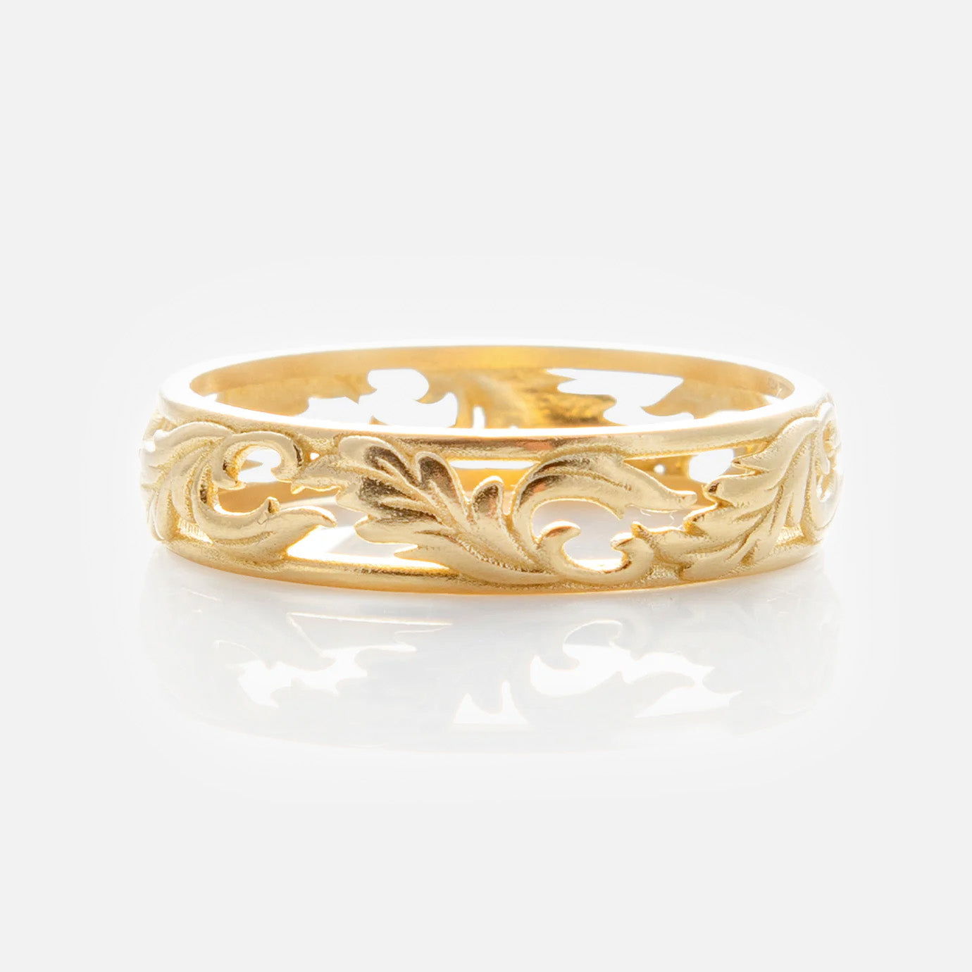 The Solid Gold Openwork Filigree Ring features an intricate leaf and vine design in yellow gold, shown against a plain white background.