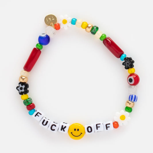 The Handmade Beaded Eff Off Bracelet features colorful mixed beads, semi-precious stones, flowers, a yellow smiley face, and letter blocks spelling “FUCK OFF” on a white background.
