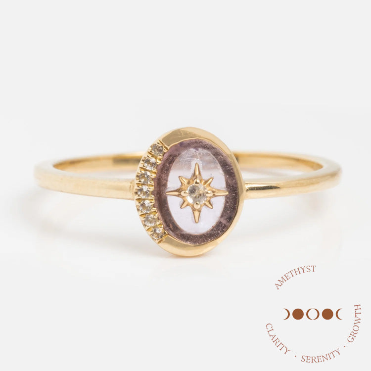 The Solid Gold Crystal Crescent Moon Ring for Manifestation showcases an oval amethyst with a star accent and diamond detail. Text nearby reads: Amethyst: Clarity • Serenity • Growth—ideal as a manifestation ring with natural crystals.