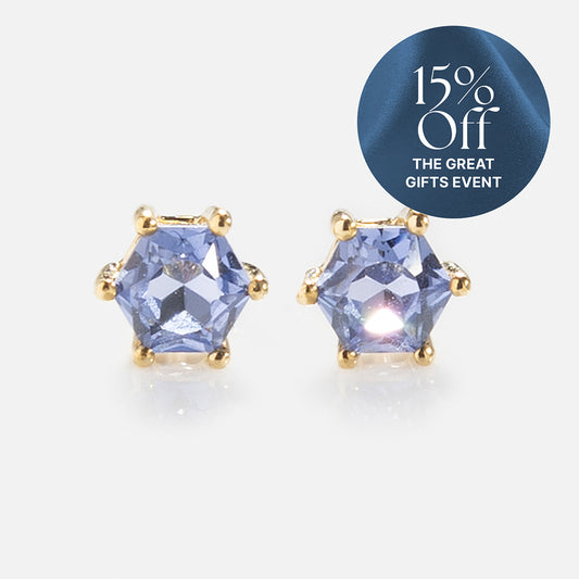 Solid Gold Modern Birthstone Studs with hexagonal blue gemstones and yellow gold settings are displayed on a white background. A circular overlay in the top right corner reads 15% Off The Great Gifts Event.