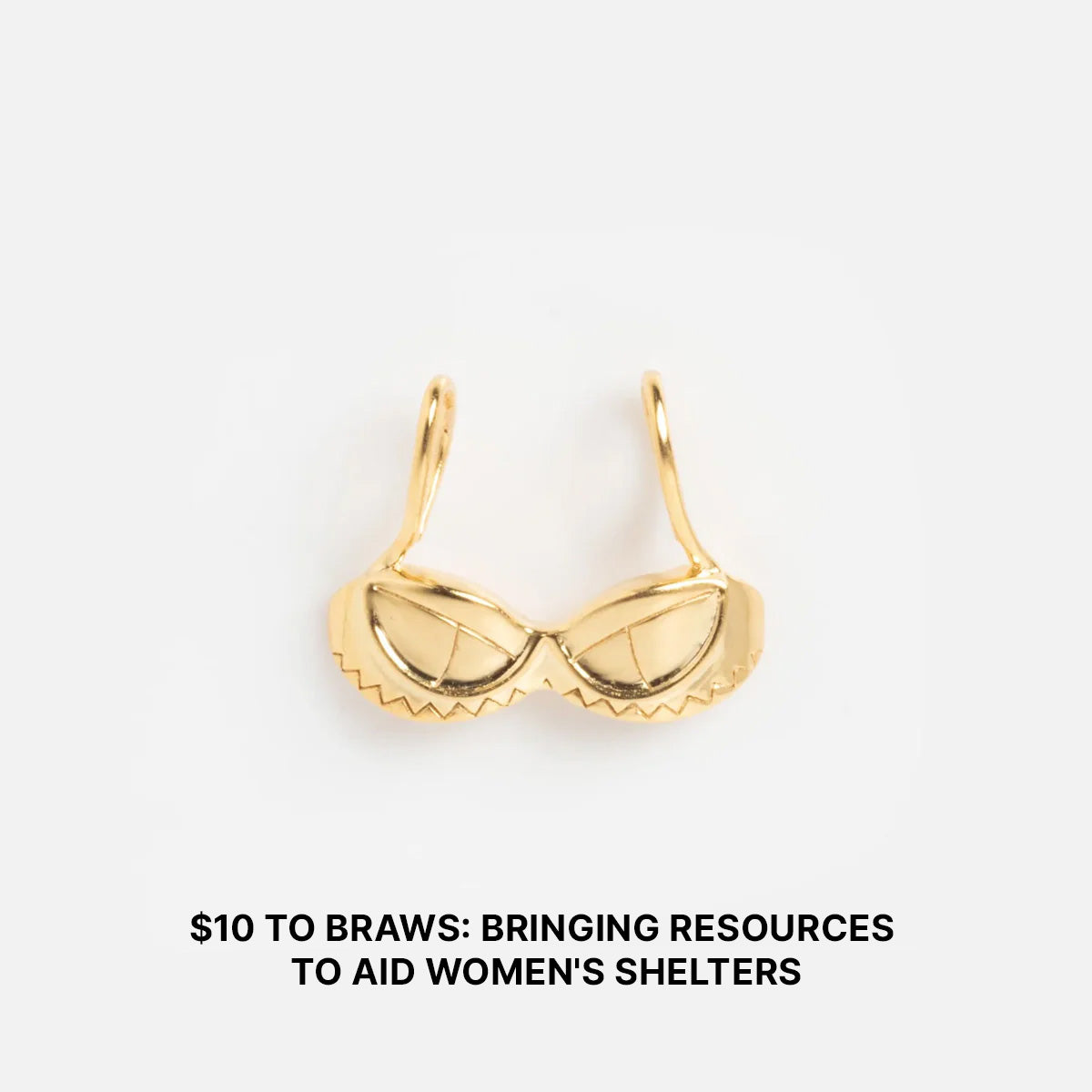 A Limited Edition Women's History Month Charm shaped like a gold bra is centered on a white background. Text below reads: $10 TO BRAWS—supporting women's shelters & reproductive freedom with each charm purchase.