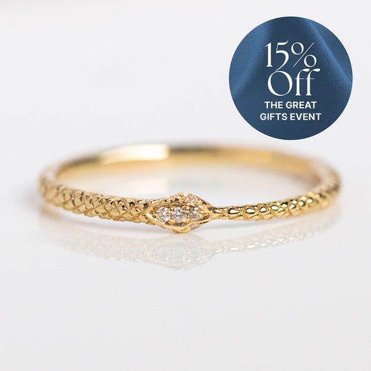 The Ouroboros Diamond Snake Ring, crafted in 14k solid gold with a textured band and diamond accents, is displayed on a white surface. A blue circle overlay in the top right corner announces 15% Off THE GREAT GIFTS EVENT.