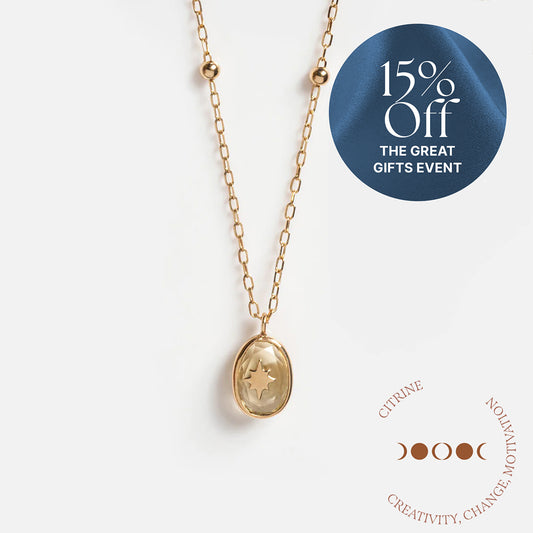 Solid Gold Crystal Amulet Necklace for Manifestation with an oval citrine pendant and star design, shown on white. 15% Off THE GREAT GIFTS EVENT. CITRINE: CREATIVITY, CHANGE, MOTIVATION—your ideal Manifestation Necklace with moon phases in a circle.