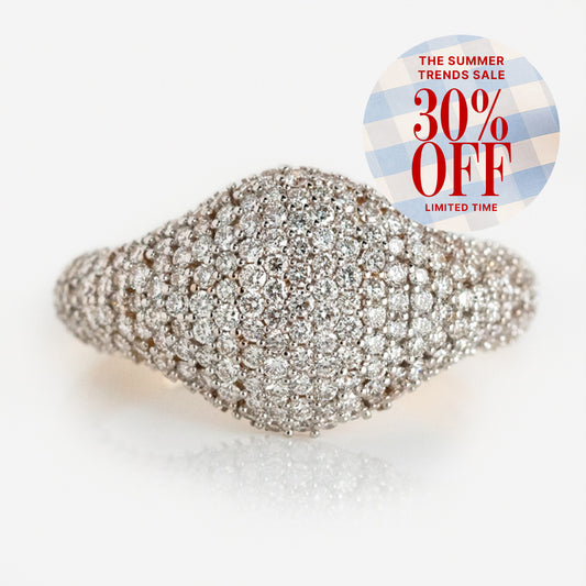 The 14k Solid Gold Pave Diamond Signet Ring, featuring a rounded dome design, is showcased on a white background. A corner badge announces “The Summer Trends Sale – 30% Off, Limited Time.”.
