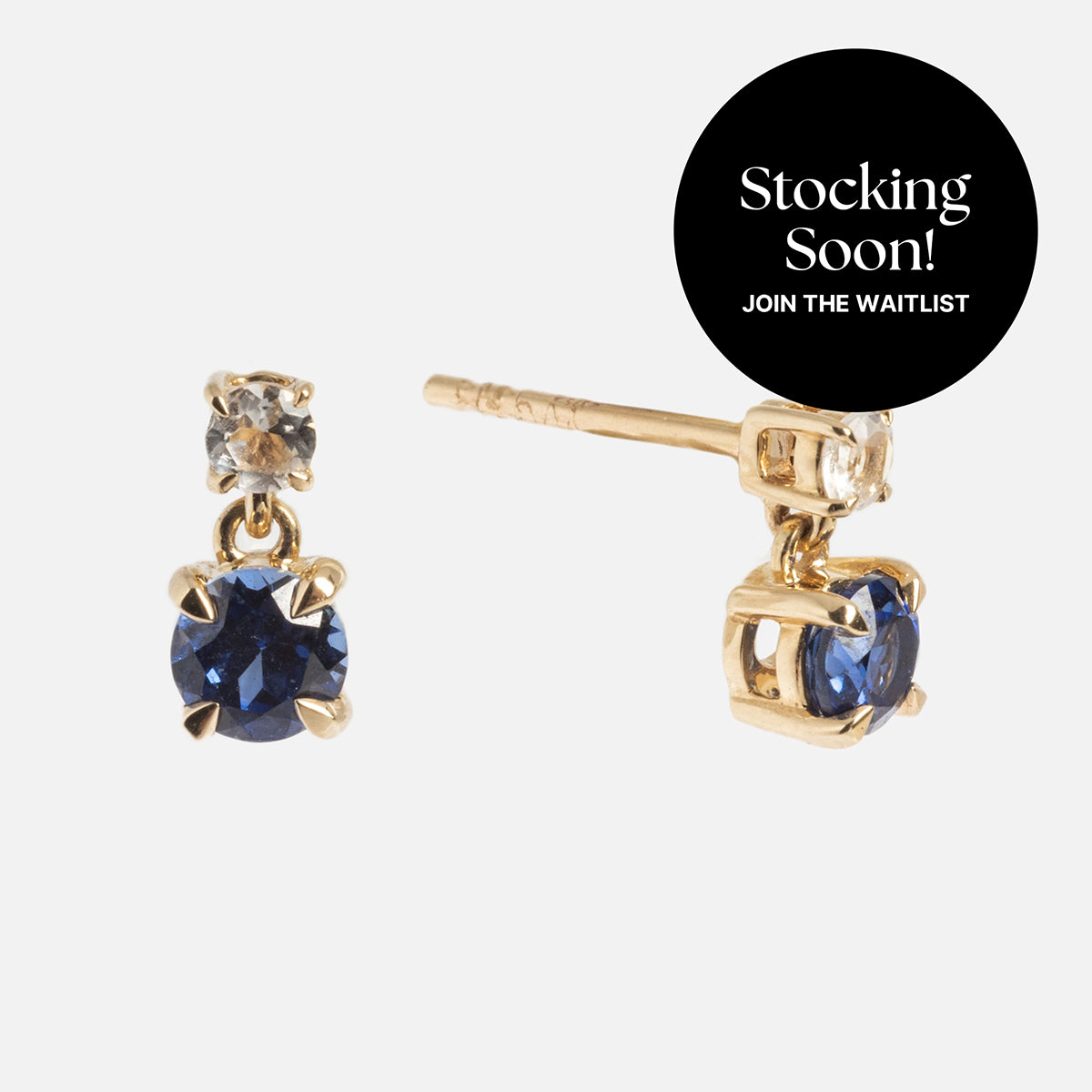 Solid Gold 2025 December Capsule Classic Tanzanite Stud Earrings: gold studs with small white topaz stones and 4 mm lab-created tanzanite gems. Stocking Soon! Join the Waitlist.