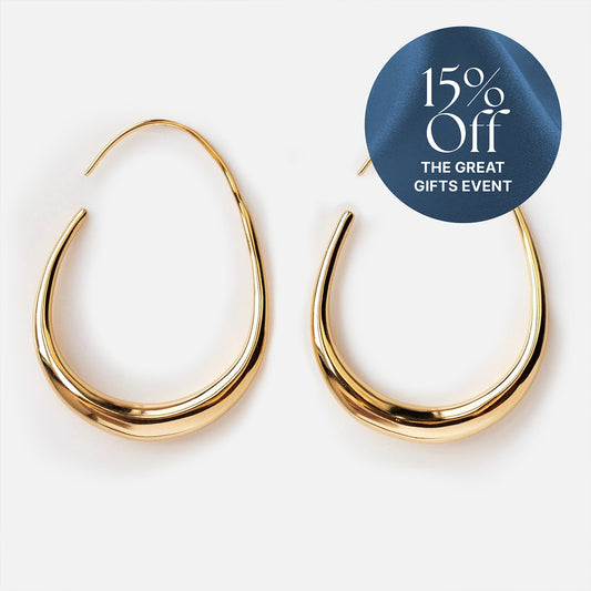 A pair of Fluid Hoop Earrings in yellow gold plated teardrop shapes shown on a white background, with a blue circle in the corner stating "15% Off THE GREAT GIFTS EVENT.