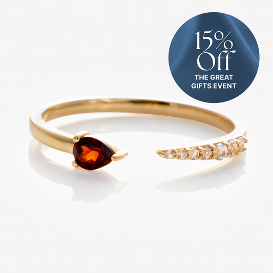 The Solid Gold Garnet and Sapphire Open Front Band features a 9k gold band with a pear-shaped red garnet and a row of white sapphires. Enjoy 15% Off The Great Gifts Event, as shown by the blue circle label.