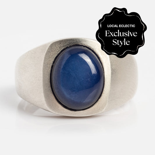 The Guardian Ring features a large, oval-shaped lab created star sapphire (10mm x 8mm) set in silver. A black badge in the top right corner reads "Local Eclectic Exclusive Style.