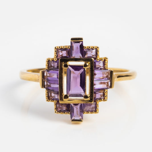 The Solid Gold 2024 February Capsule Vintage Inspired Amethyst Statement Ring features a rectangular-cut center amethyst with smaller accent stones in a geometric design, crafted from 9k yellow gold with a polished finish. Sample size 5.