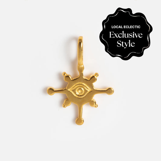 Charms by Hunt of Hounds: A gold vermeil pendant in a stylized eye shape with six spokes ending in small balls. Features a Local Eclectic Exclusive Style badge. Ideal for layering with your favorite charms.