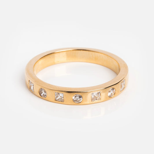 The Solid Gold 2024 April Capsule Diamond Statement Band Sample Size 7 features a flat-profile yellow gold band with alternating round and square lab diamonds set evenly in 9k gold, shown on a white background.
