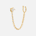 The Ear Cuff with CZ Dangle Chain features a square-cut gemstone stud on one end and a curved gold-plated ear cuff with small round stones on the other, shown against a white background.