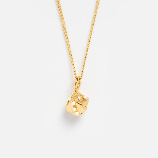 The Casino Necklace is gold plated and features a textured dice pendant with visible dot markings, shown against a plain white background.