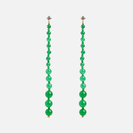 The Miami Vice Earrings showcase graduated green beads lined up on small round studs, creating striking green drop earrings against a white background.