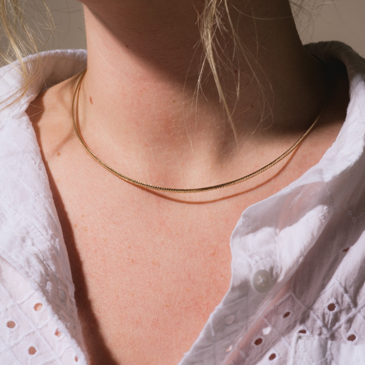 Close up of Model wearing Family Gold Solid Gold Slim Mesh Necklace