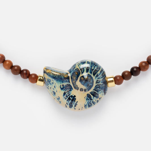 Closeup of Edith Barbarella Cove Necklace central blue seashell 