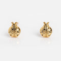 Lady Bug Studs feature a minimal design with raised dots and simple detailing, crafted in 14k gold plating. These small earrings are showcased on a plain white background.